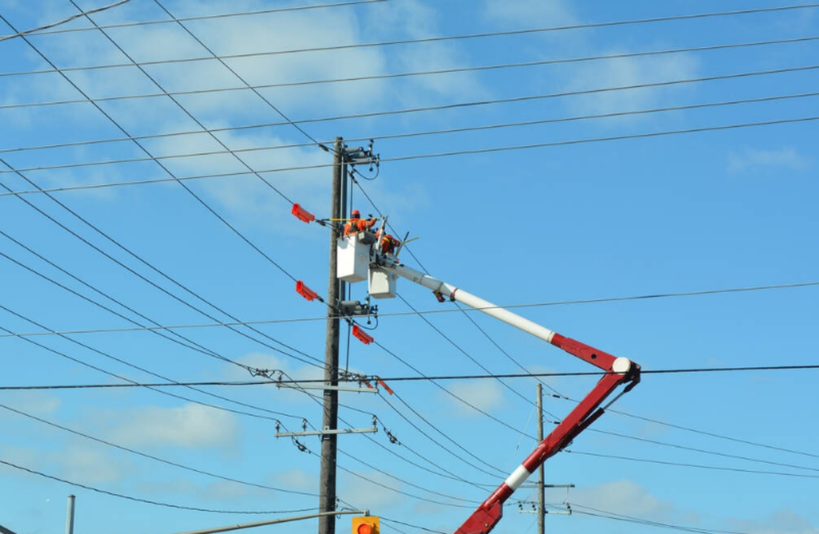 Light pole setting service near me by South Florida Pole Setters and Crane Service, Inc. in Stuart, FL with crane and equipment