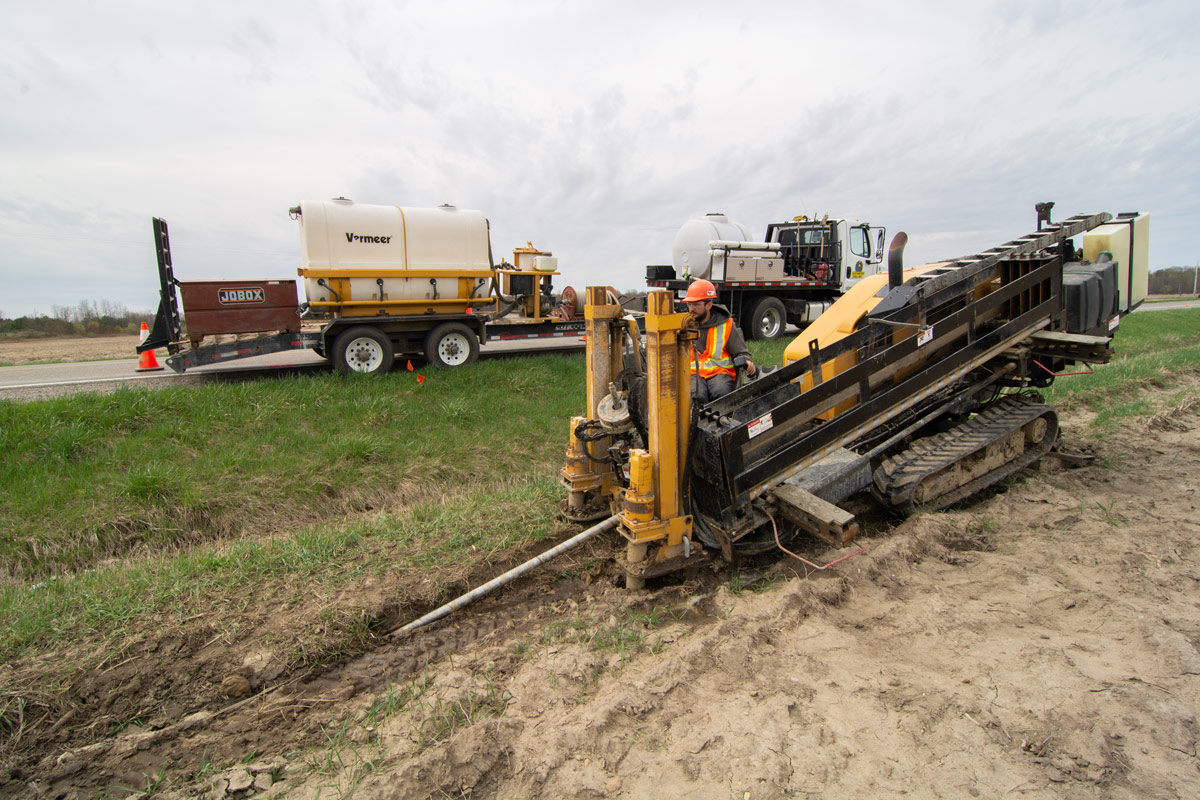 Technicians monitoring the drilling process with advanced tracking systems
