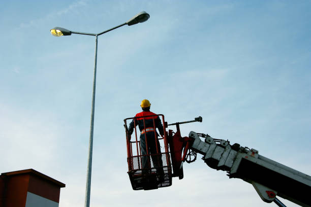 Professional crew performing safe street light installation service in Florida.