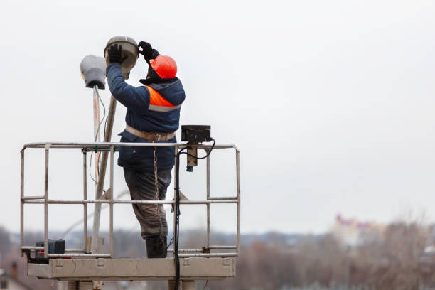 South Florida Pole Setters repairing outdoor light fixtures in West Palm Beach.