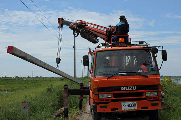 Florida pole setter drilling foundation for reliable structural pole installation.