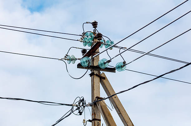 Power pole installation improving property electrical access reliability
